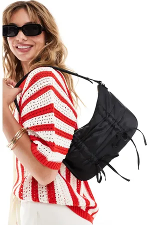 Cotton On Bolso de hombro negro con lazos de satén Aries de Cotton On