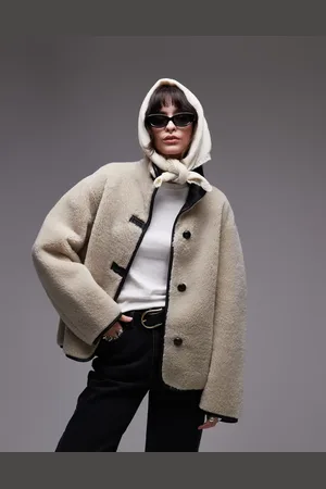 MANGO Chaqueta beis con cuello alzado de borreguito de