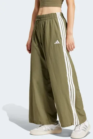 adidas Pantalones verdes estilo paracaidista con 3 rayas Essentials Lifestyle de