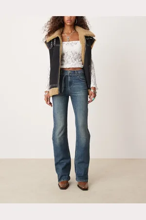 Free People Vaqueros de pernera recta holgada con lavado azul medio y cinturón Sabine de