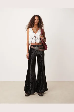 Free People Pantalones negros plisados de pernera ancha de terciopelo efecto rugoso de