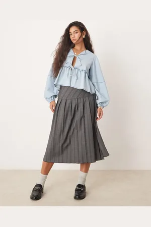 Free People Blusa vaquera azul con lavado claro y lazada delantera de