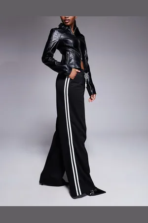 River Island Jogger negros de pernera ancha con raya lateral de