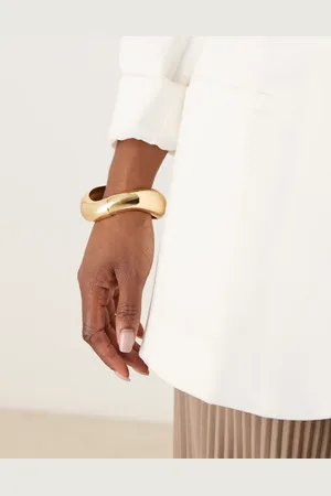 ASOS Pulsera dorada rígida con diseño retorcido de
