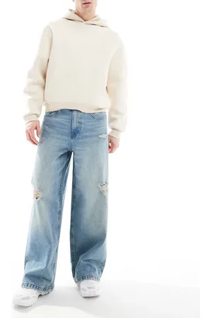 ASOS Vaqueros azules rasgados muy holgados con lavado envejecido de