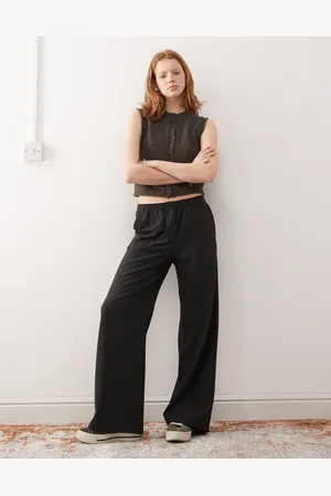 Weekday Pantalones negros a cuadros de pernera ancha con cintura elástica Kelly de