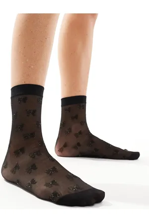 Pretty Polly Calcetines negros transparentes con patrón de lazos brillantes de