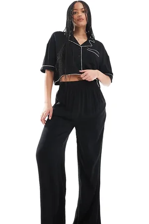 ASOS Pantalones de pijama negros elegantes de pernera ancha con ribetes en contraste de tejido muy suave de ASOS DESIGN Tall