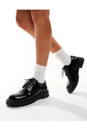 Schuh Zapatos negros con cordones de charol Logan de