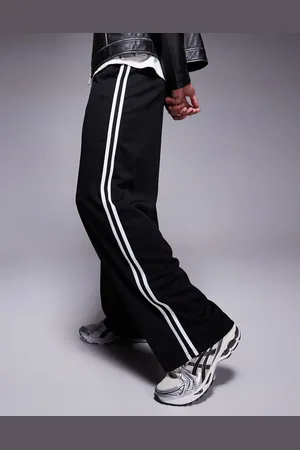 ASOS Joggers negros de corte globo holgado con cinta en el lateral de