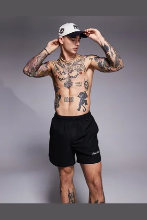 ASOS Shorts de baño negros de largo medio con bordado posicional de