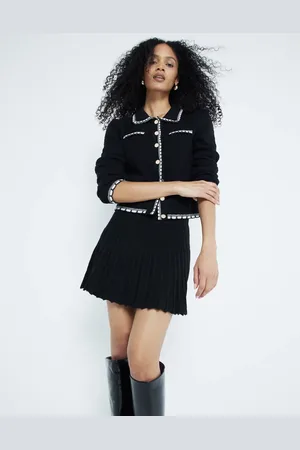 River Island Minifalda negra con vuelo de