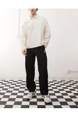 adidas Pantalones chinos negros básicos con trébol Trefoil Essentials de
