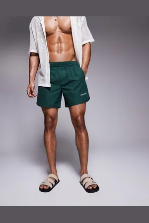 ASOS Shorts de baño verdes de largo medio con detalle bordado de