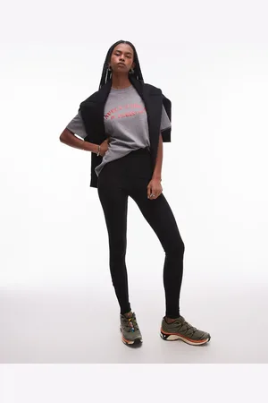 ARKET Leggings negros estructurados con detalle de cremallera en el bajo de