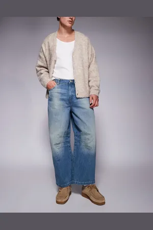 ASOS Vaqueros azules de corte herradura con lavado claro de