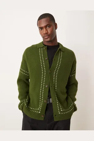 ASOS Polo holgado con botones de