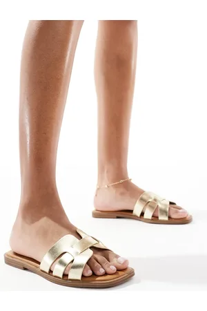SEQWL Sandalias planas doradas Stork de