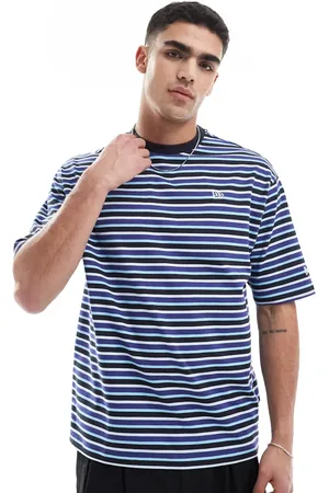 New Era Camiseta a rayas verticales en contraste con logo de