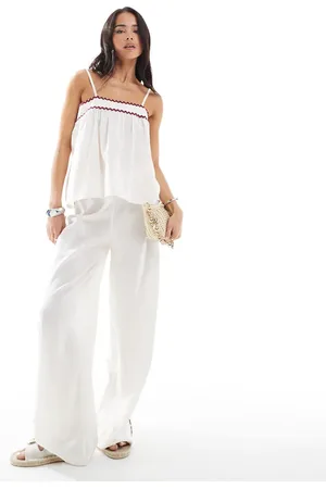 Esmée Pantalones playeros blancos con ribetes en zigzag rojos exclusivos de (parte de un conjunto)