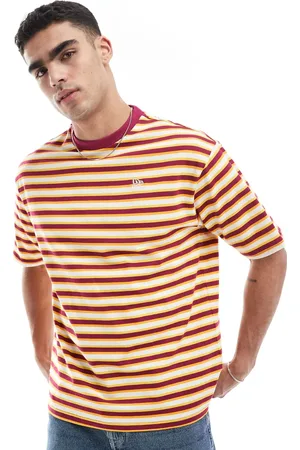 New Era Camiseta con rayas multicolores verticales en contraste y logo de