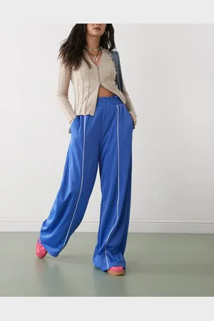 Monki Pantalones de chándal azules de pernera ancha sin cierres con ribetes blancos de