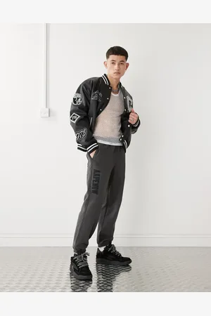 A Bathing Ape Joggers gris lavado con bajos ajustados y logo en el lateral de