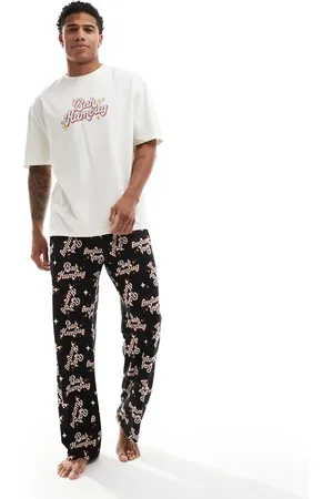 ASOS Pijama negro con estampado de texto "Bah Humbug" de