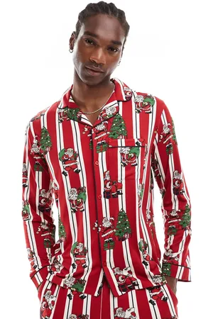 Chelsea Peers Pijama de top de manga larga con cuello de solapas y pantalones a rayas con estampado navideño de Papá Noel de poliéster His & Hers de
