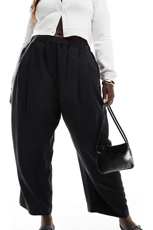 ASOS Pantalones lavado de estilo casual sin cierres con pinzas de ASOS DESIGN Curve