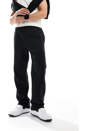 New Era Joggers negros de pernera ancha con logo de