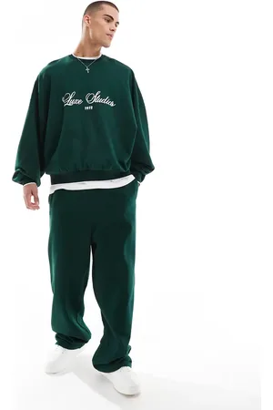 ASOS Joggers verde oscuro de pernera ancha con cinta en contraste en el lateral de