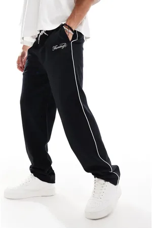 ASOS Joggers negros de pernera recta con detalles bordados y ribetes de