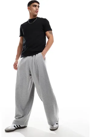 ASOS Joggers gris jaspeado de corte bombacho extragrande con estampado de