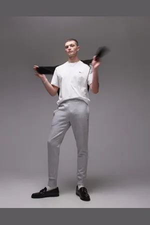 Lacoste Pantalones de chándal grises de corte slim con logo de