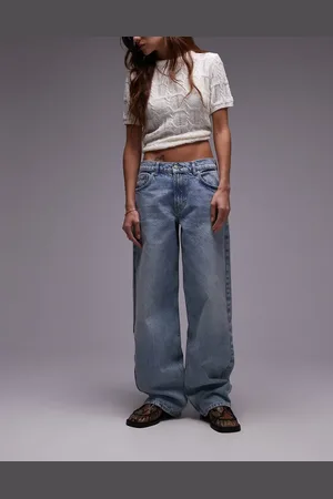 Topshop Vaqueros descoloridos de talle bajo y corte holgado con detalle regulable de -Azul