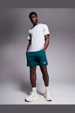 The North Face Pantalones cortos de 7" verdes con logo 24/7 de
