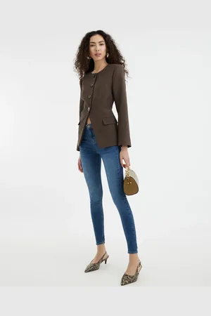 River Island Vaqueros moldeadores de corte pitillo con lavado de