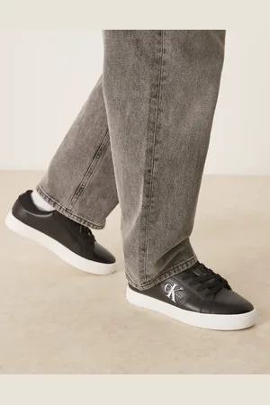 Calvin Klein Zapatillas de deporte negras y blancas clásicas con suela cupsole de cuero de -Negro