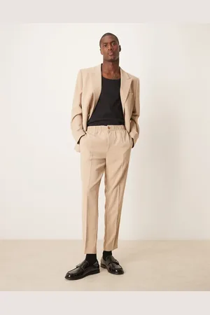 ASOS Pantalones de traje color de corte tapered de tejido texturizado de -Neutro