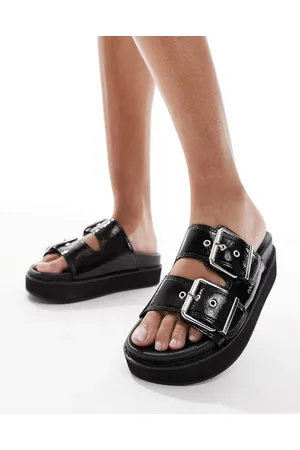 New Look Sandalias negras con diseño de dos tiras y plataforma plana de poliuretano de
