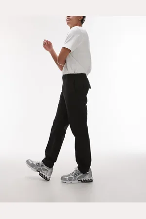 MANGO Pantalones negros de corte slim de tejido deportivo transpirable de