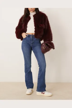 Gina Tricot Vaqueros elásticos de pernera acampanada y talle alto con lavado azul intenso de