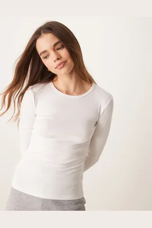 Gina Tricot Top hueso de manga larga con cuello redondo de punto acanalado de