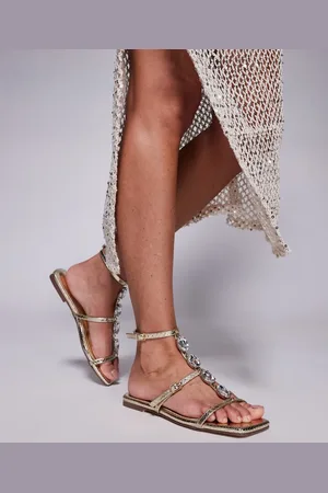 Simmi London Sandalias planas doradas con detalle de tira de pedrería Azura de SIMMI London