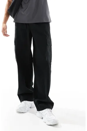 ASOS Pantalones cargo negros muy holgados con cinturilla elástica de