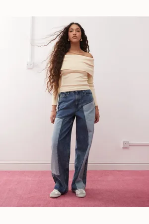 Miss Selfridge Vaqueros holgados con diseño de parches y lavado azul de