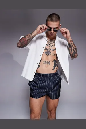 ASOS Shorts de baño muy cortos con raya diplomática blanca de -Negro