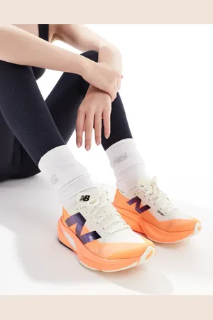 New Balance Zapatillas de deporte naranjas Fuelcell Rebel V4 de Running