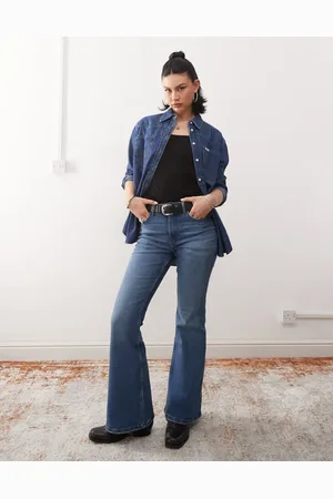 Wrangler Vaqueros de campana azules con lavado medio envejecido Fierce de